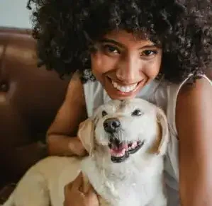 happy pet parent with dog 300x294 1 e1774845124881